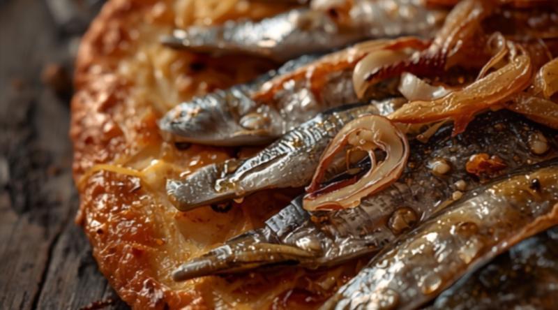 Primer plano de coca de sardinas con cebolla caramelizada